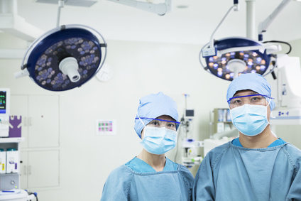 Portrait of two surgeons wearing surgical masks in the operating